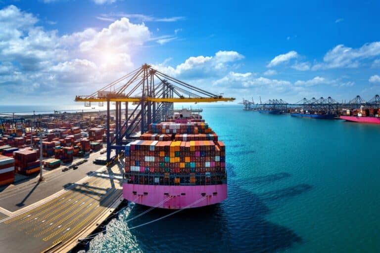 A cargo boat with a lot of shipping containers - one of the types of freight.